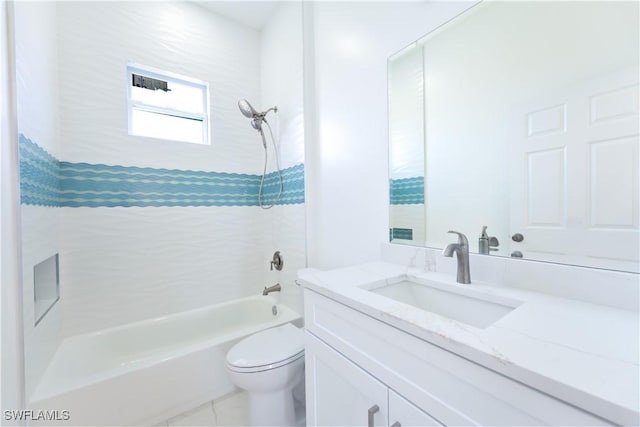 full bathroom with vanity, toilet, and tiled shower / bath