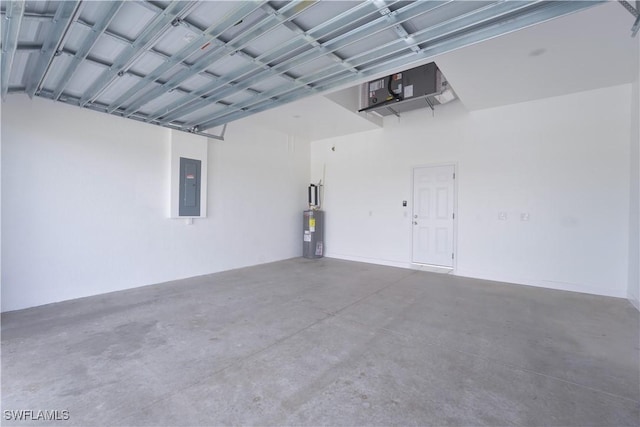 garage with electric panel and water heater