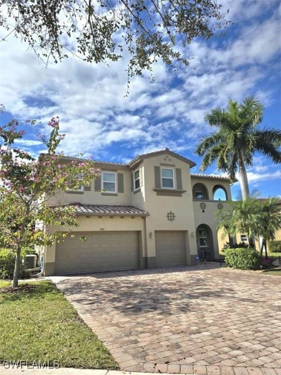 mediterranean / spanish-style home featuring a garage