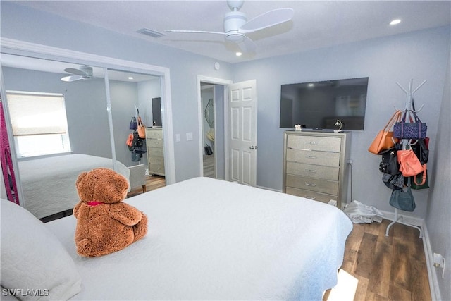 bedroom with ceiling fan, visible vents, recessed lighting, wood finished floors, and baseboards
