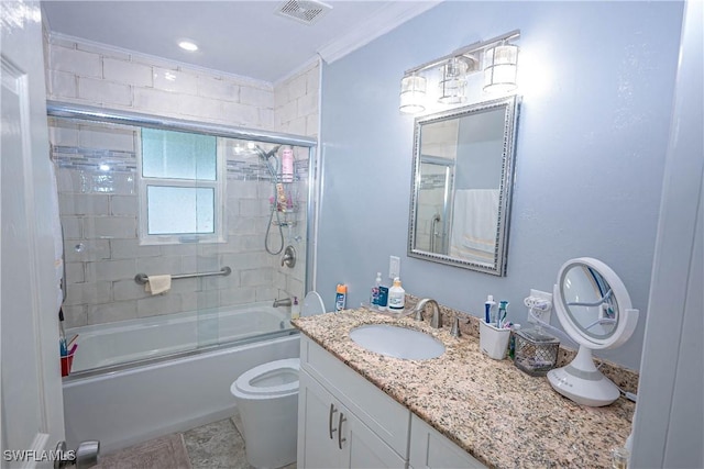 full bathroom with visible vents, toilet, enclosed tub / shower combo, crown molding, and vanity