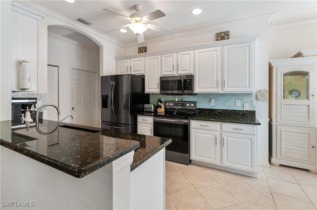 kitchen with white cabinetry, appliances with stainless steel finishes, crown molding, and kitchen peninsula