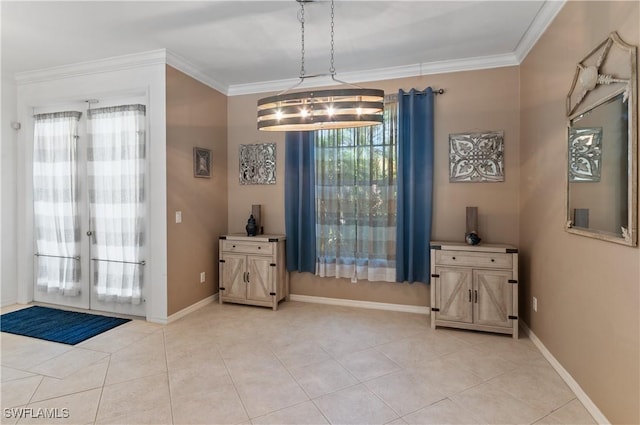 interior space with crown molding and french doors