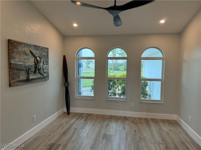 unfurnished room featuring ceiling fan and light wood-type flooring