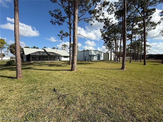 view of yard with a lanai