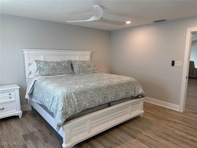 bedroom featuring wood-type flooring and ceiling fan