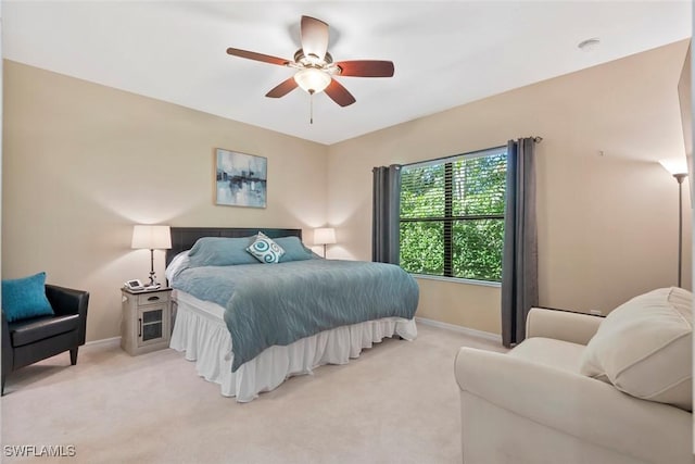 bedroom featuring ceiling fan and light colored carpet