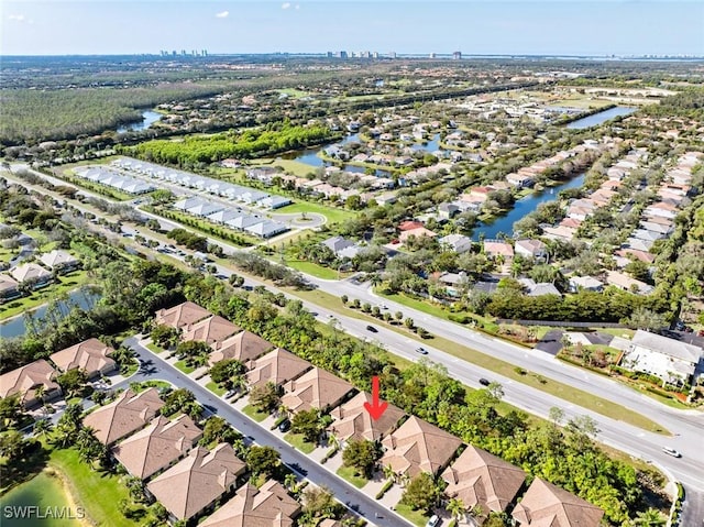 birds eye view of property featuring a water view