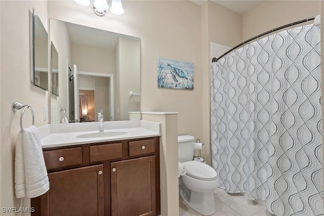 bathroom featuring a shower with curtain, vanity, tile patterned flooring, and toilet