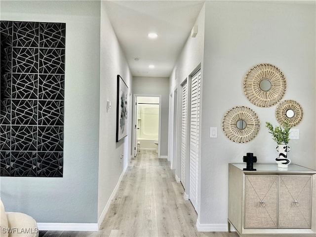 corridor featuring light hardwood / wood-style floors