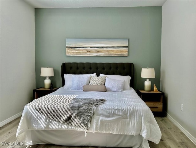 bedroom with light hardwood / wood-style flooring