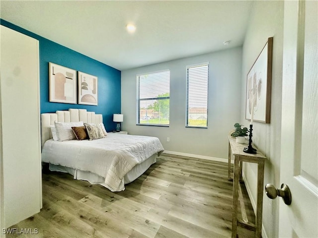 bedroom with light hardwood / wood-style flooring