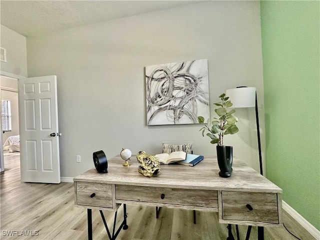 home office featuring light hardwood / wood-style floors