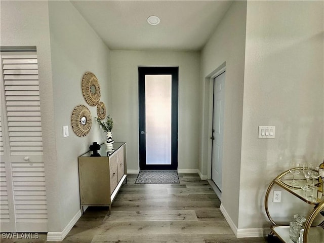 entryway with light hardwood / wood-style floors