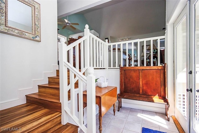 stairs featuring tile patterned flooring, ceiling fan, and french doors