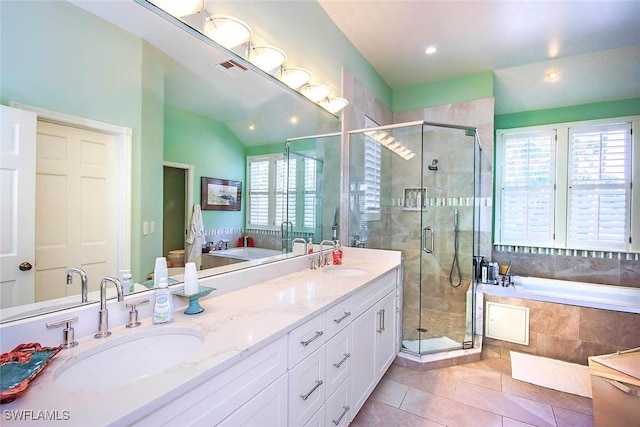 bathroom with tile patterned flooring, vanity, shower with separate bathtub, and a healthy amount of sunlight