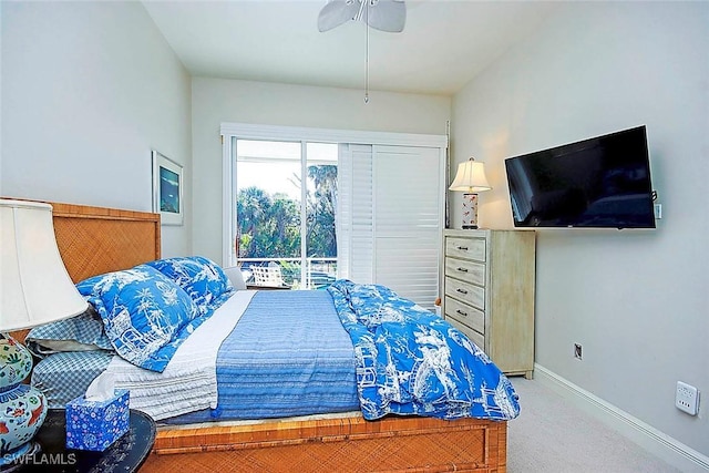 bedroom featuring access to outside, ceiling fan, and carpet flooring