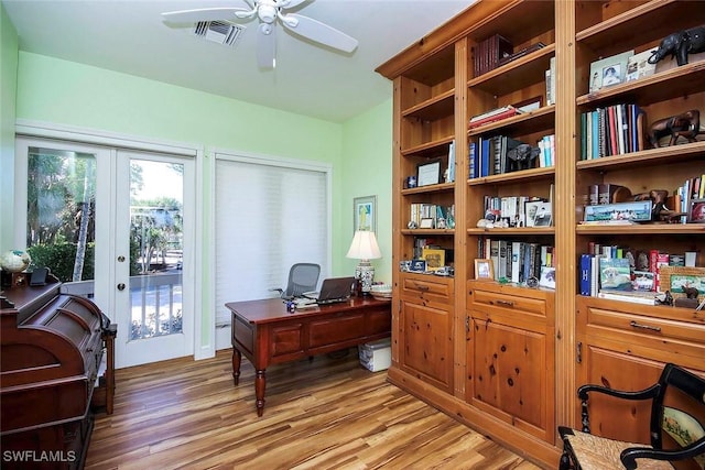 office area featuring hardwood / wood-style floors, ceiling fan, and french doors