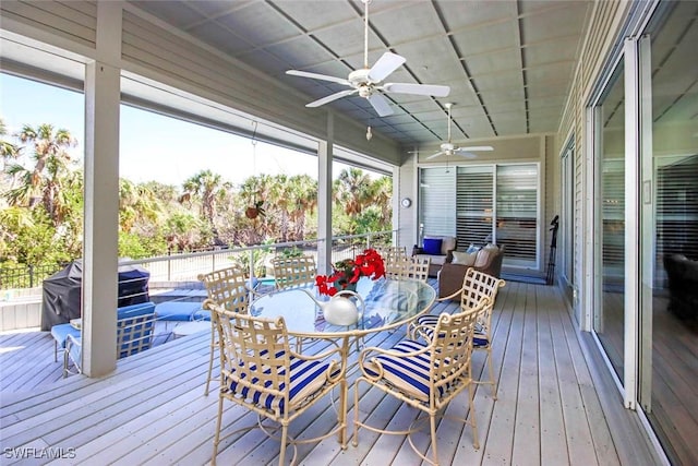 sunroom / solarium with ceiling fan and a wealth of natural light