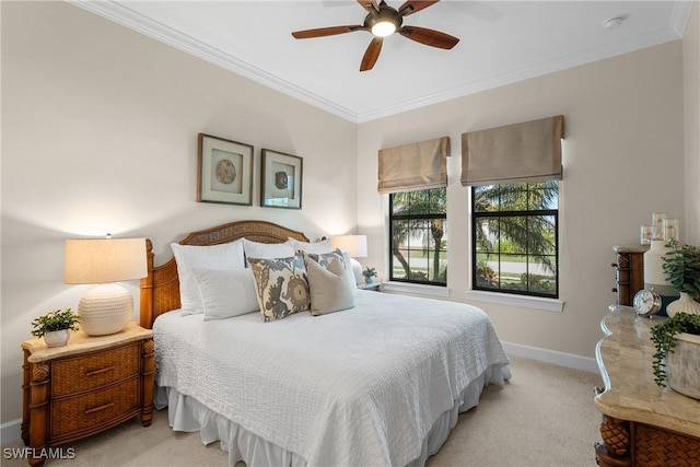 carpeted bedroom with ceiling fan and ornamental molding