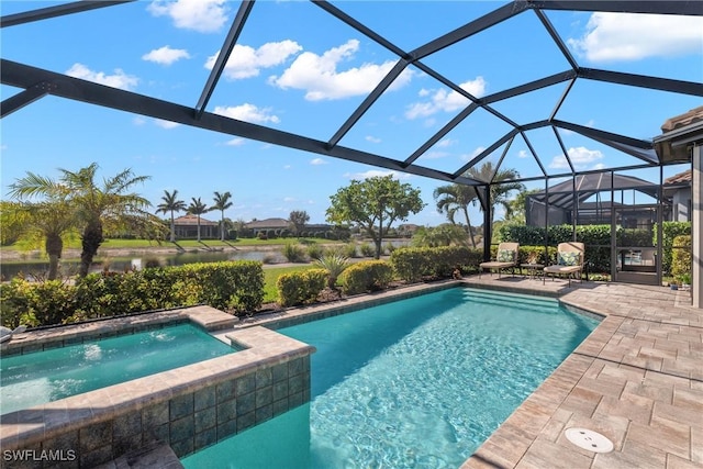 view of swimming pool featuring a patio, glass enclosure, and an in ground hot tub