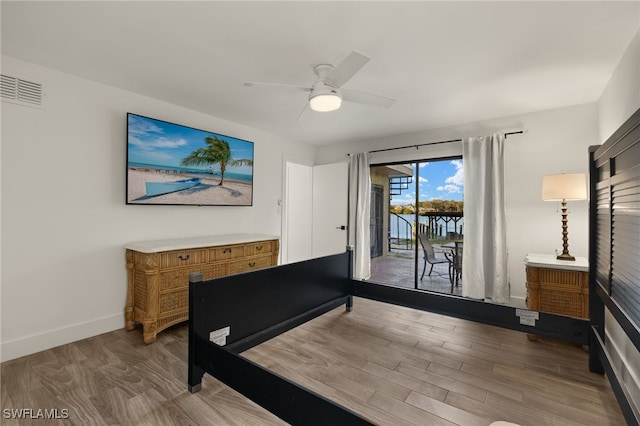 bedroom featuring ceiling fan, light wood-type flooring, and access to outside