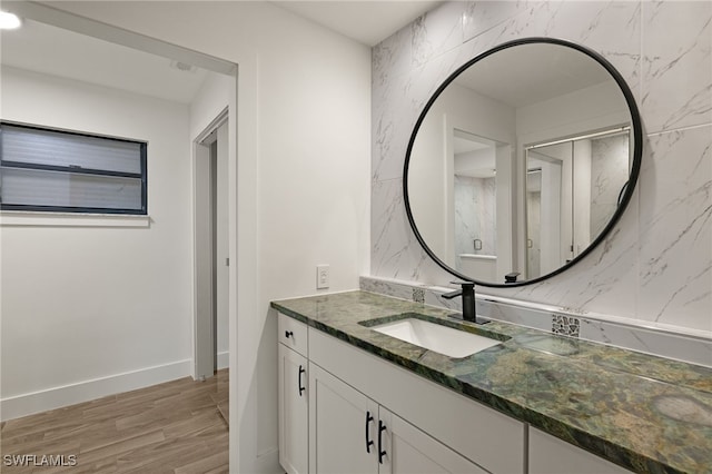 bathroom with wood-type flooring and vanity