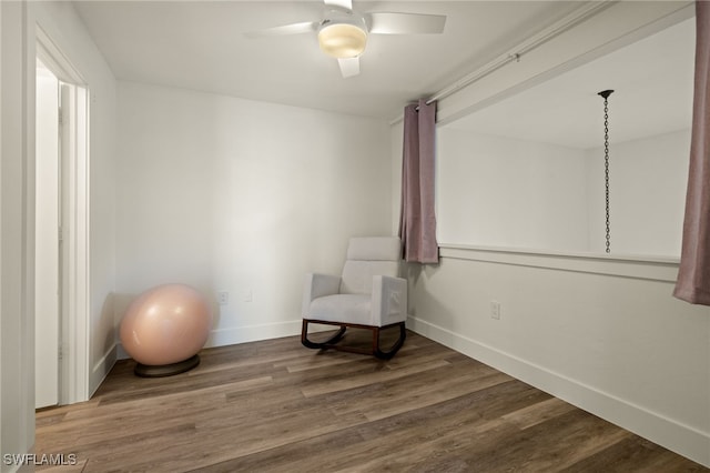 sitting room featuring hardwood / wood-style flooring and ceiling fan