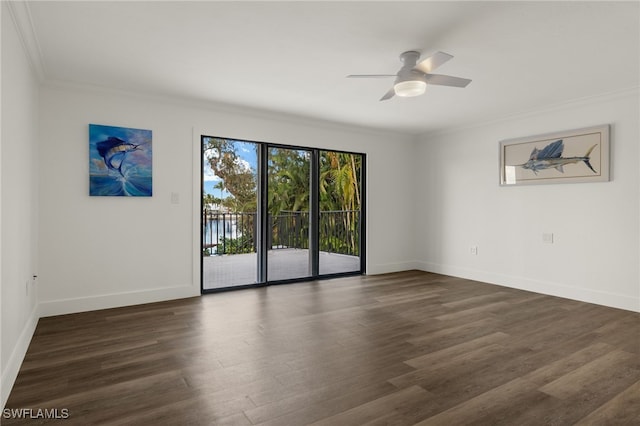 empty room with ornamental molding, dark hardwood / wood-style floors, and ceiling fan