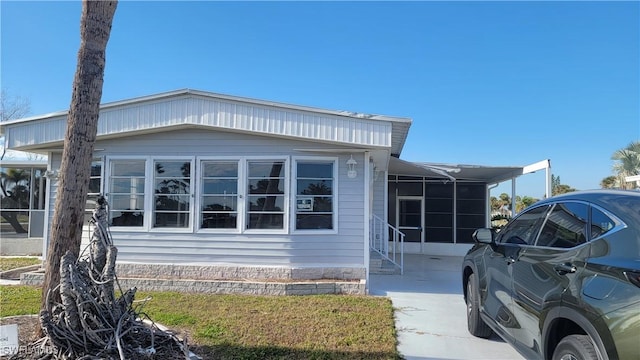 view of home's exterior with a carport