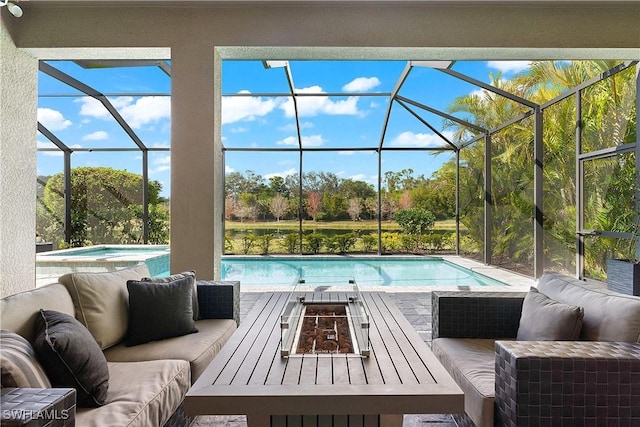 view of pool featuring an outdoor living space with a fire pit, a hot tub, a patio, and glass enclosure