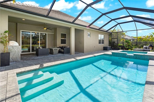 view of pool featuring ceiling fan, a patio, glass enclosure, an outdoor living space, and an in ground hot tub