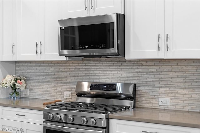 kitchen featuring white cabinetry, tasteful backsplash, and stainless steel appliances