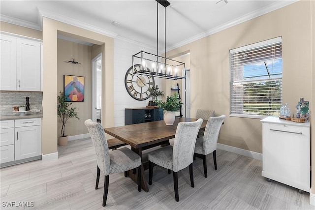 dining space with ornamental molding