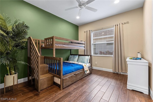 bedroom with dark wood-type flooring and ceiling fan