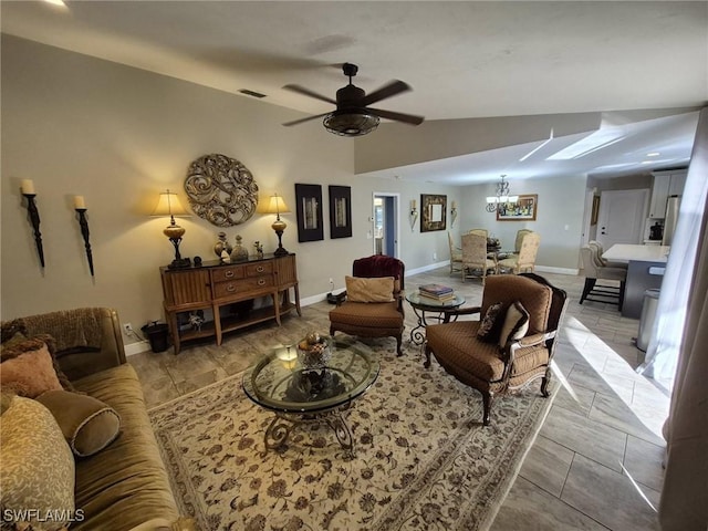 living room with lofted ceiling and ceiling fan with notable chandelier