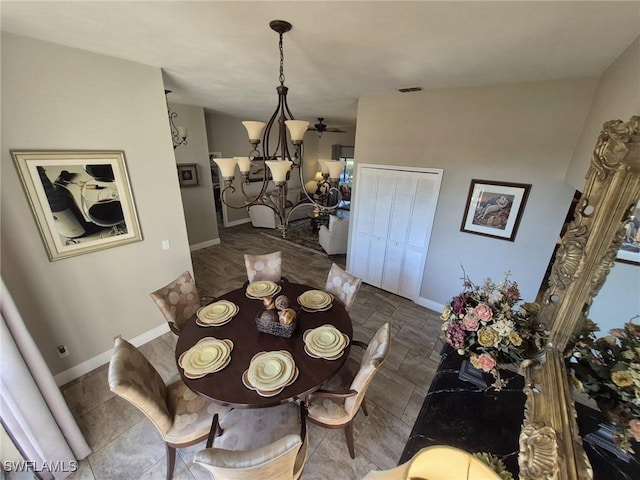 dining space featuring a notable chandelier