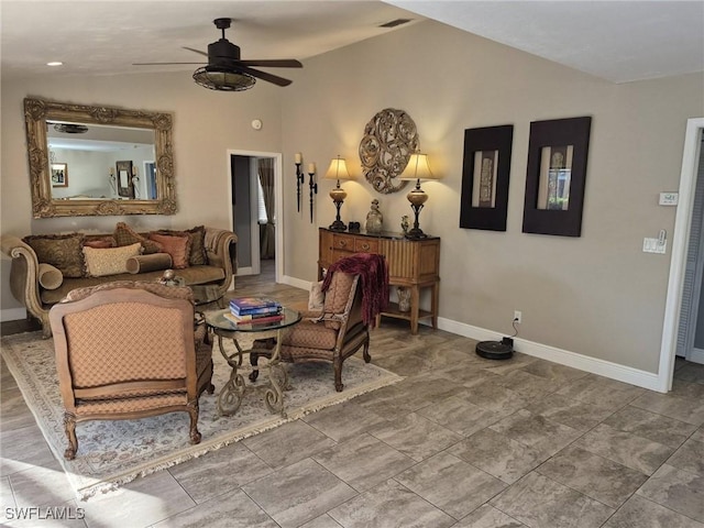 living area featuring ceiling fan and lofted ceiling