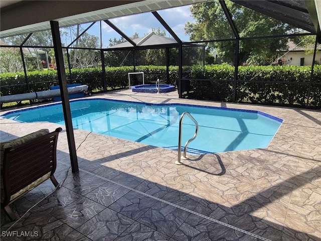 view of swimming pool with a patio, glass enclosure, and an in ground hot tub