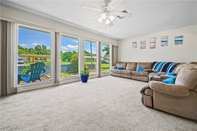 living room with carpet floors and ceiling fan