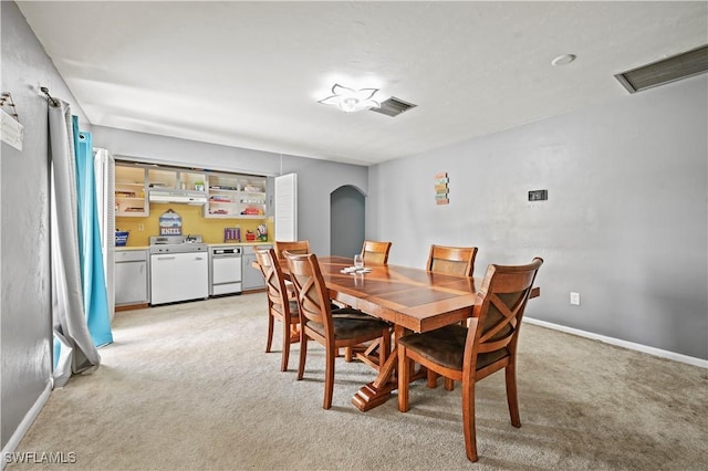 view of carpeted dining space