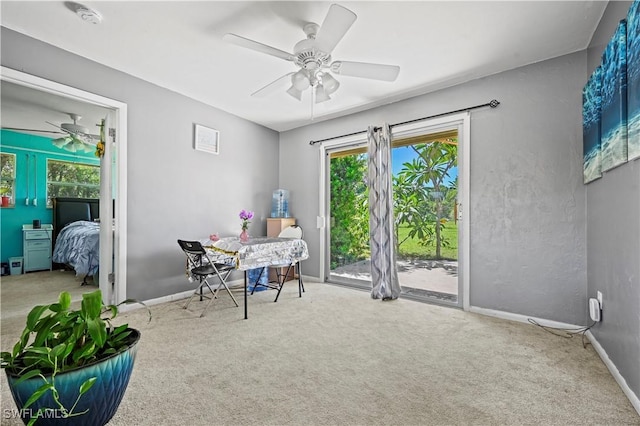 interior space with ceiling fan and carpet