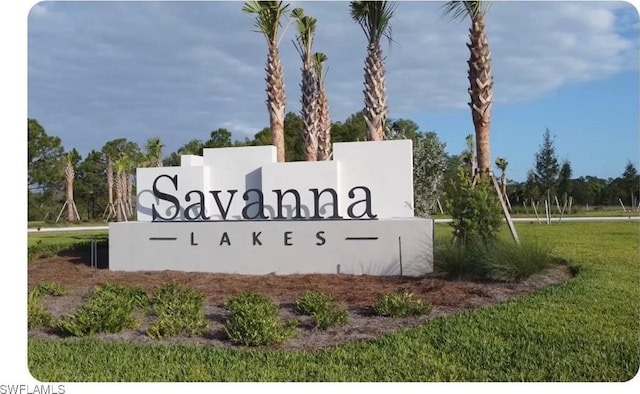 12230 Dakota Ridge Pl, Lehigh Acres, FL 33974 - community sign featuring a lawn
