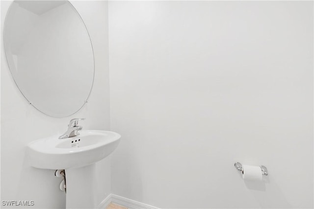 12230 Dakota Ridge Pl, Lehigh Acres, FL 33974 - bathroom featuring baseboards