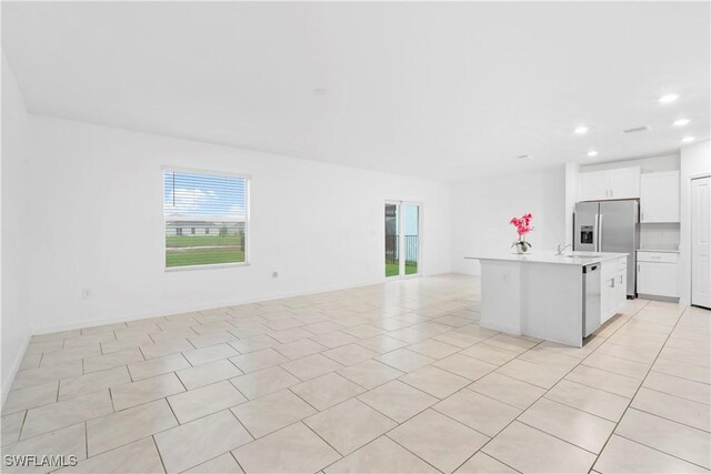 12230 Dakota Ridge Pl, Lehigh Acres, FL 33974 - kitchen featuring open floor plan, light countertops, recessed lighting, dishwashing machine, and stainless steel refrigerator with ice dispenser