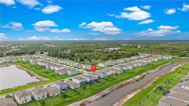 12230 Dakota Ridge Pl, Lehigh Acres, FL 33974 - aerial perspective of suburban area with a large body of water