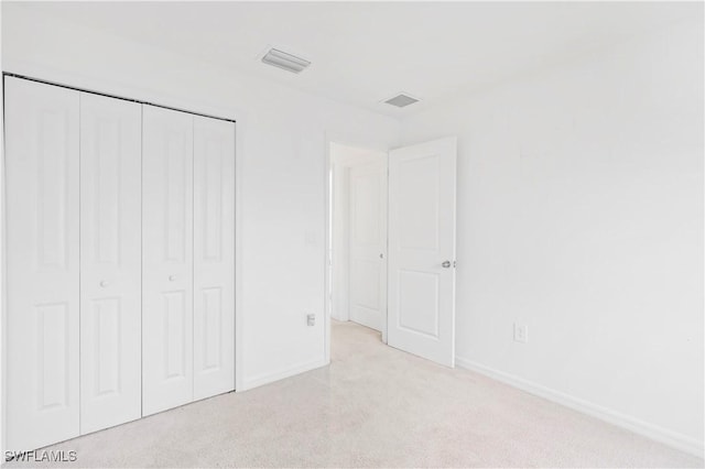 12230 Dakota Ridge Pl, Lehigh Acres, FL 33974 - unfurnished bedroom featuring carpet flooring, baseboards, and a closet