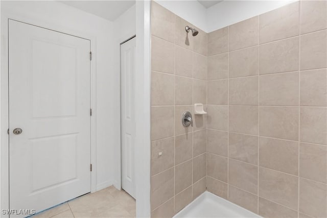 12230 Dakota Ridge Pl, Lehigh Acres, FL 33974 - full bath featuring tiled shower, a closet, and tile patterned floors