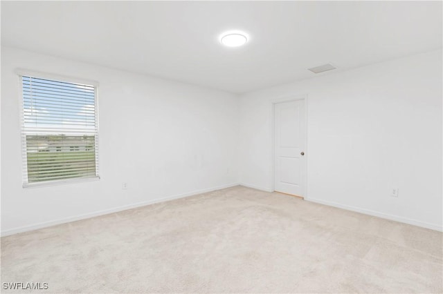 12230 Dakota Ridge Pl, Lehigh Acres, FL 33974 - unfurnished room with light carpet and baseboards