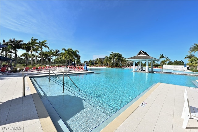 view of swimming pool with a gazebo and a patio area